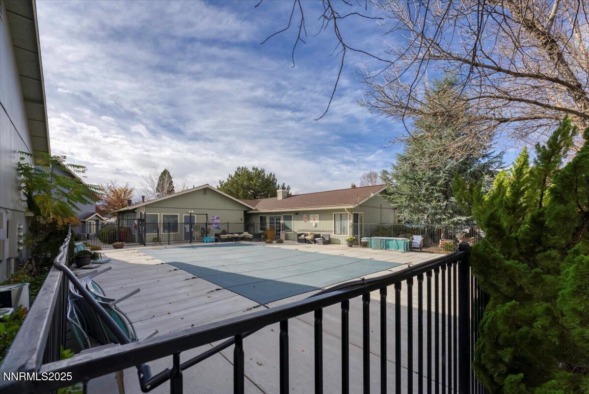 3230 Wedekind Road, Unit 64 Sparks, NV 89431 - Photo 26 of 28 a view of a roof deck with table and chairs under an umbrella