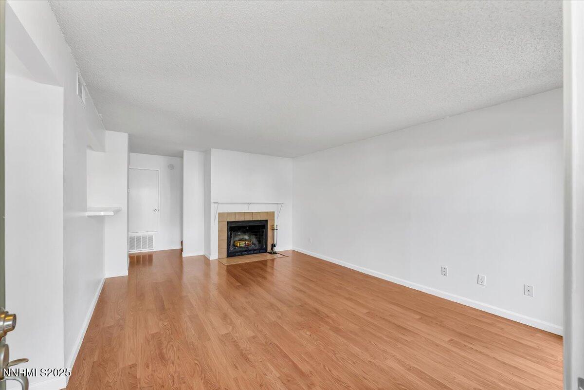 3230 Wedekind Road, Unit 64 Sparks, NV 89431 - Photo 5 of 28 a view of empty room with wooden floor