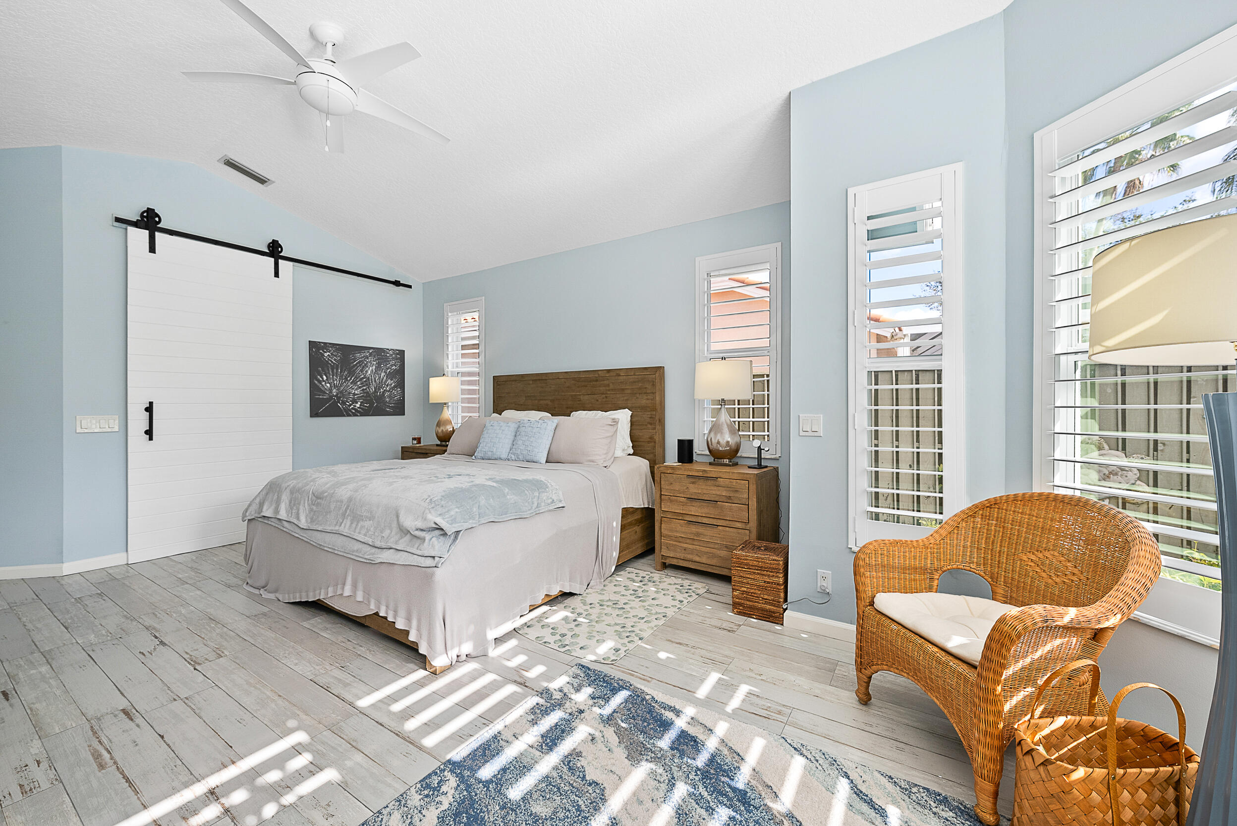271 Eagleton Estates Boulevard Palm Beach Gardens, FL 33418 - Photo 14 of 37 a bedroom with a bed and a couch next to a window