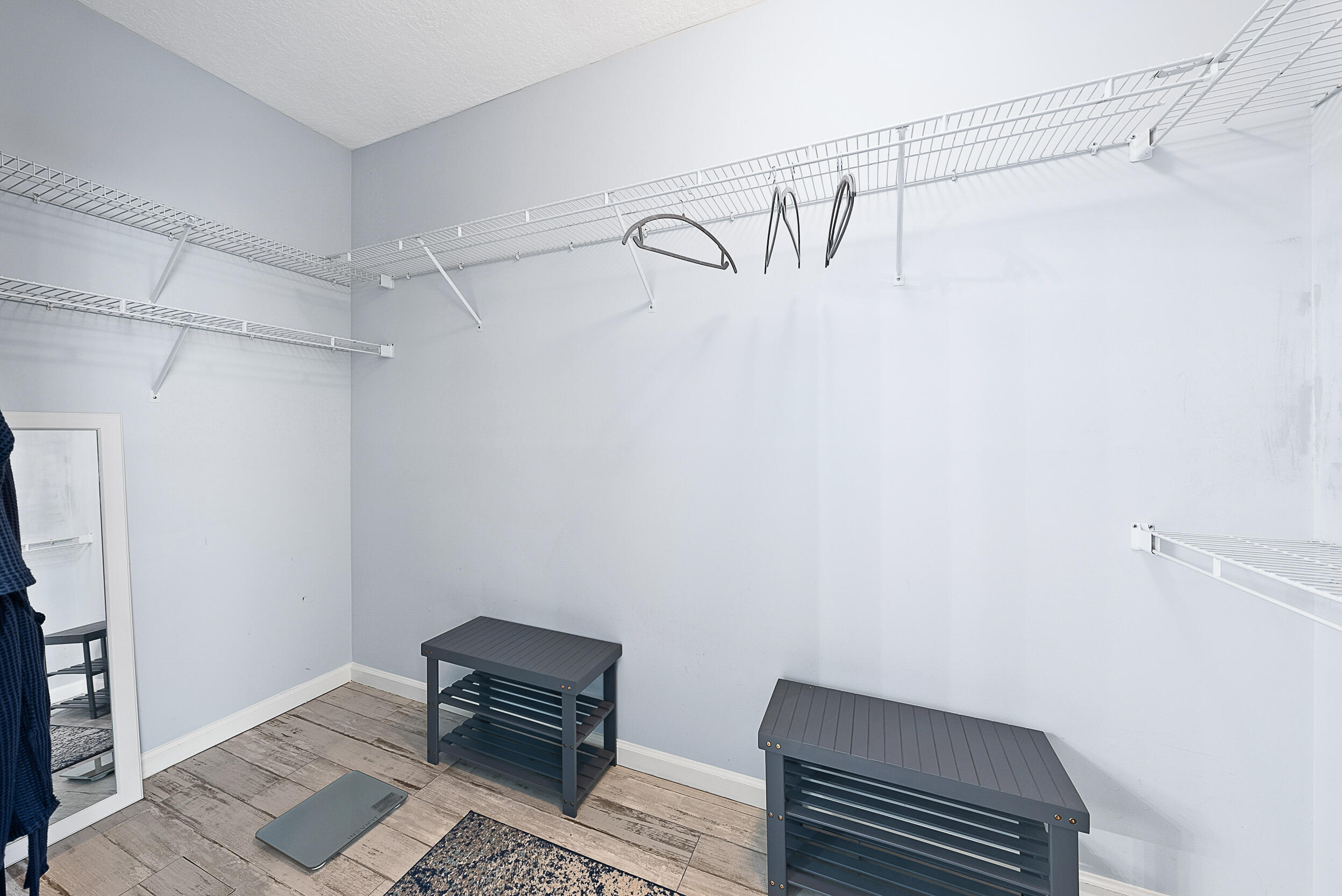 271 Eagleton Estates Boulevard Palm Beach Gardens, FL 33418 - Photo 15 of 37 a view of a room with racks on the wall