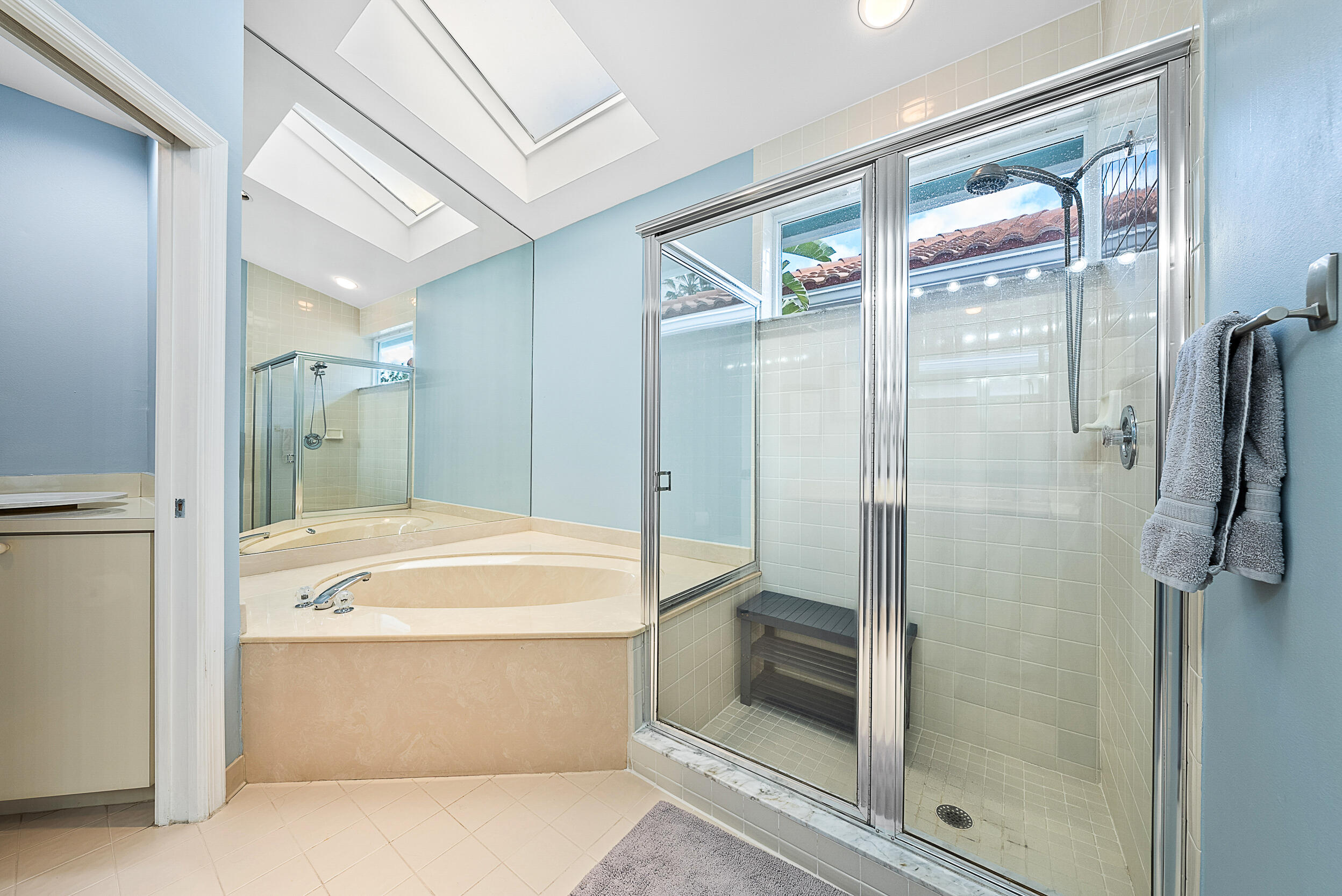 271 Eagleton Estates Boulevard Palm Beach Gardens, FL 33418 - Photo 17 of 37 a bathroom with a tub and a shower