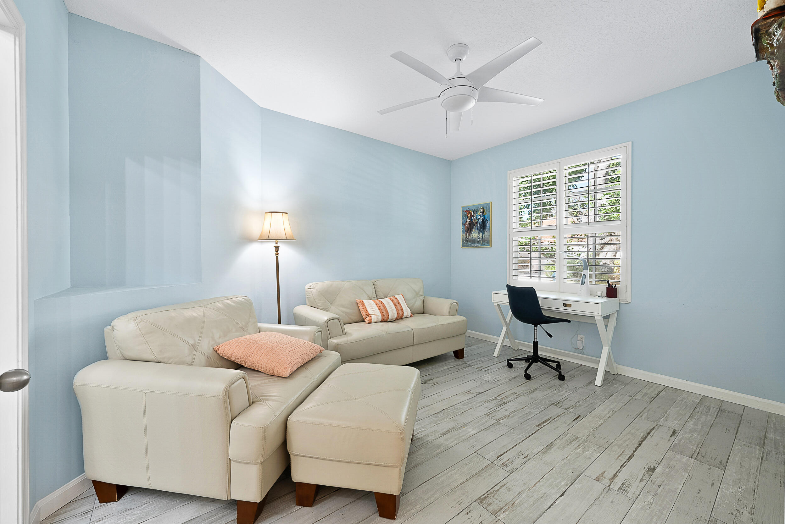 271 Eagleton Estates Boulevard Palm Beach Gardens, FL 33418 - Photo 22 of 37 a living room with furniture and a window