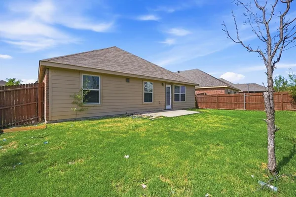 a white toilet sitting next to a bath tub