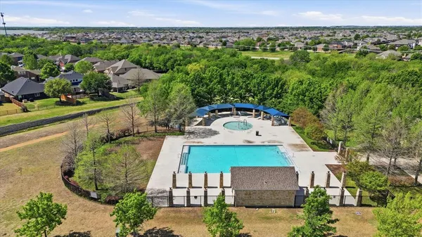 an aerial view of a house with a garden