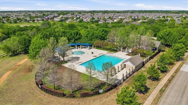 a view of a swimming pool with a balcony