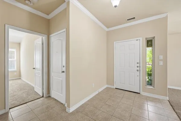 a view of a hallway with a wooden door