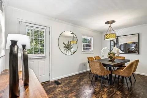 a view of a room with wooden floor