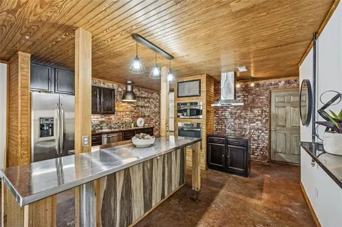 a view of balcony with wooden floor and fence