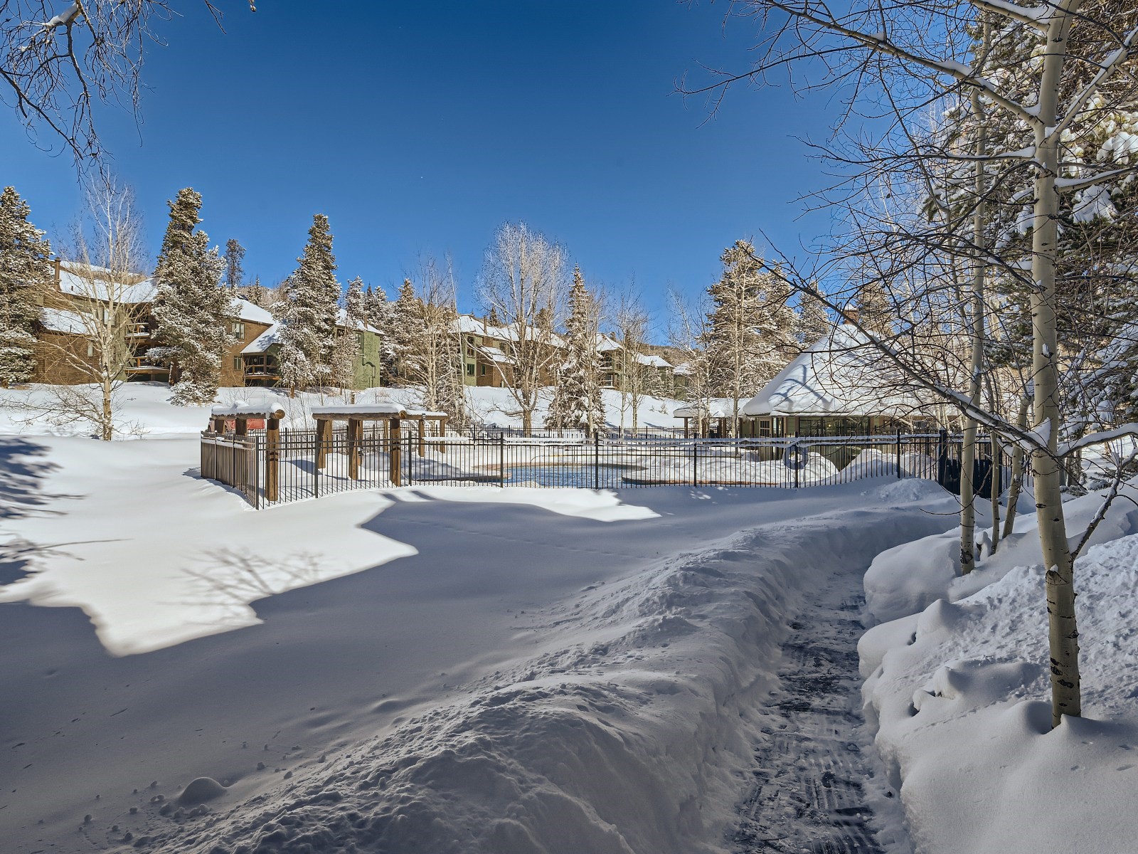 2017 Soda Ridge Road, Unit 1939 Keystone, CO 80435 - Photo 22 of 27 Walkway from unit towards the pool and hot tub building