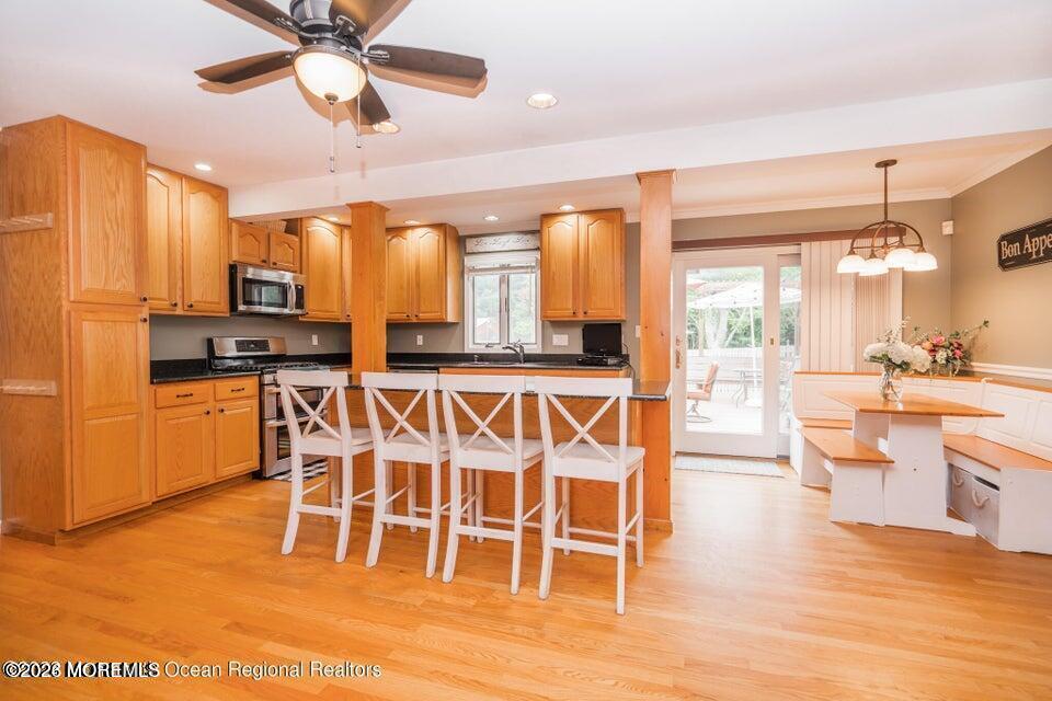 1 Kari Court Jackson, NJ 08527 - Photo 21 of 66 a view of a kitchen with kitchen island granite countertop wooden floor and stainless steel appliances
