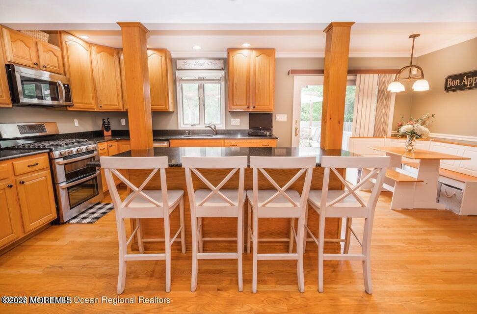 1 Kari Court Jackson, NJ 08527 - Photo 22 of 66 a view of a kitchen with stainless steel appliances kitchen island granite countertop a dining table and chairs