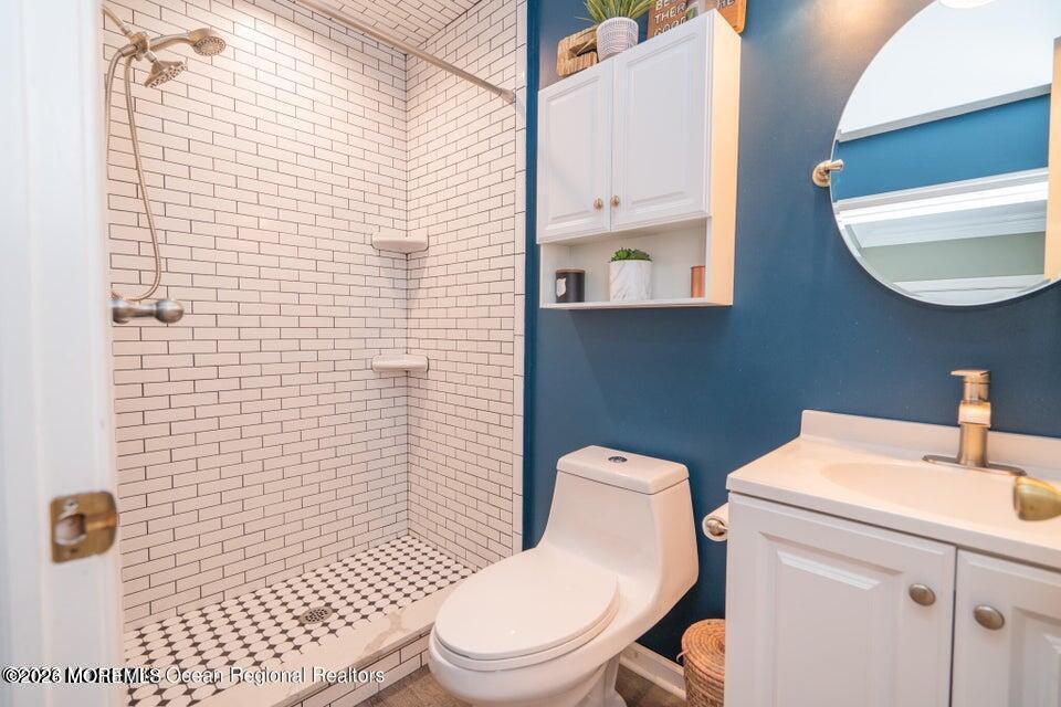 1 Kari Court Jackson, NJ 08527 - Photo 28 of 66 a bathroom with a sink a toilet and a mirror