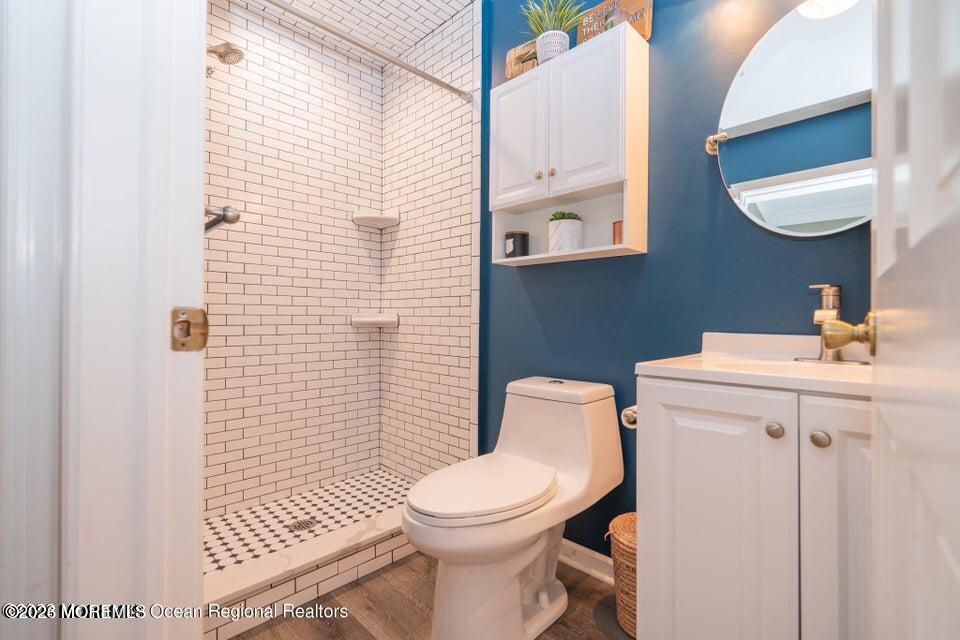 1 Kari Court Jackson, NJ 08527 - Photo 29 of 66 a white toilet sitting next to a bathroom sink