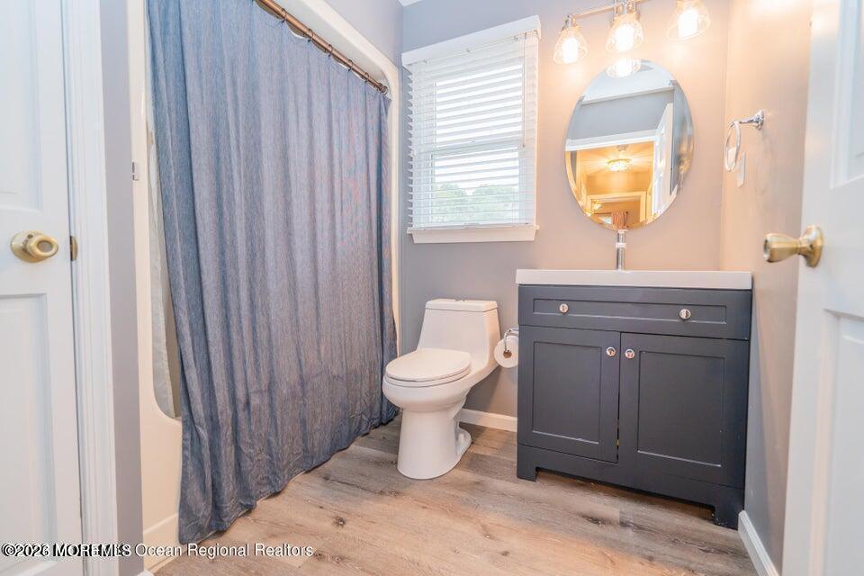 1 Kari Court Jackson, NJ 08527 - Photo 36 of 66 a bathroom with a toilet a sink and a mirror