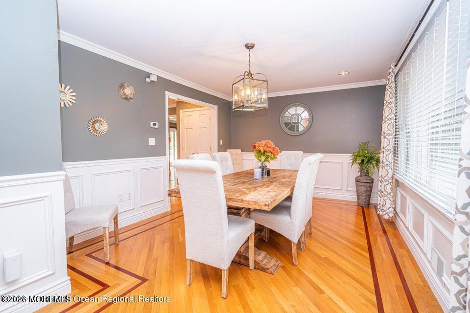 1 Kari Court Jackson, NJ 08527 - Photo 9 of 66 a view of a dining room with furniture and a chandelier