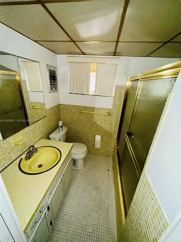 a living room with furniture and a clock