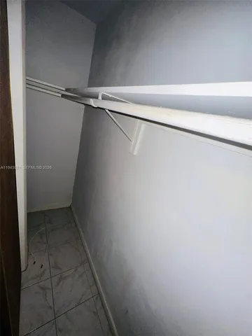 a view of swimming pool with outdoor seating and plants