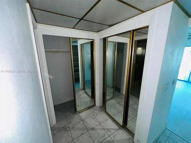 a bathroom with a tub and a shower