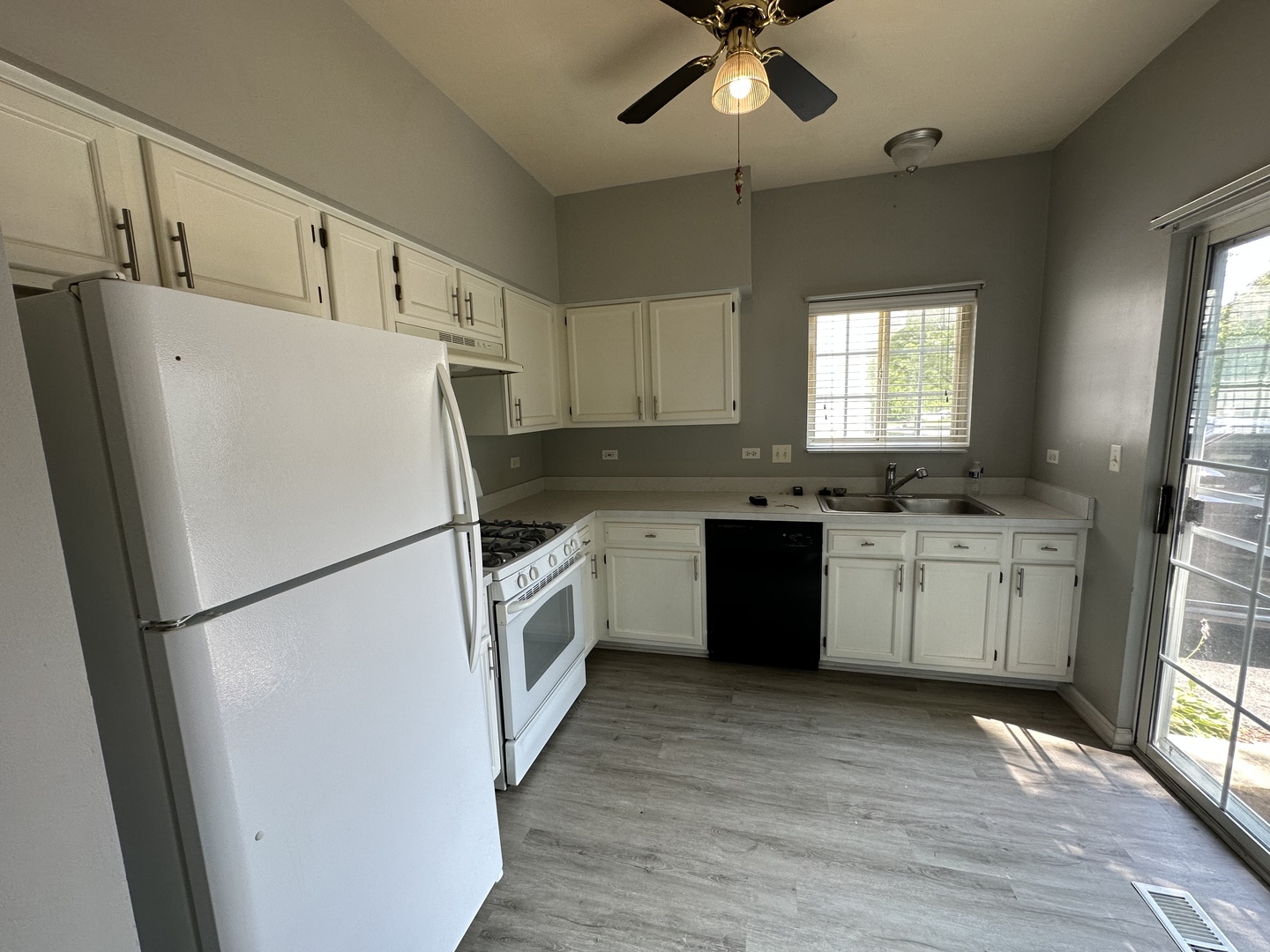 130 Creston Circle Aurora, IL 60504 - Photo 5 of 11 a white refrigerator freezer sitting inside of a kitchen