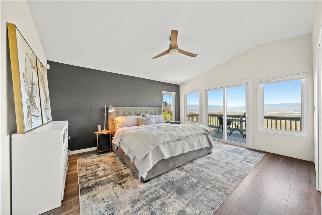 6607 New Ridge Drive Riverside, CA 92506 - Photo 15 of 46 a bedroom with a large bed and a window