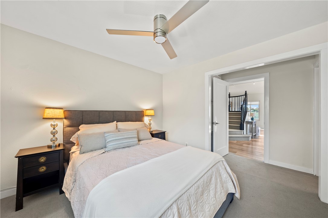 6607 New Ridge Drive Riverside, CA 92506 - Photo 19 of 46 a bedroom with a bed and a night stand