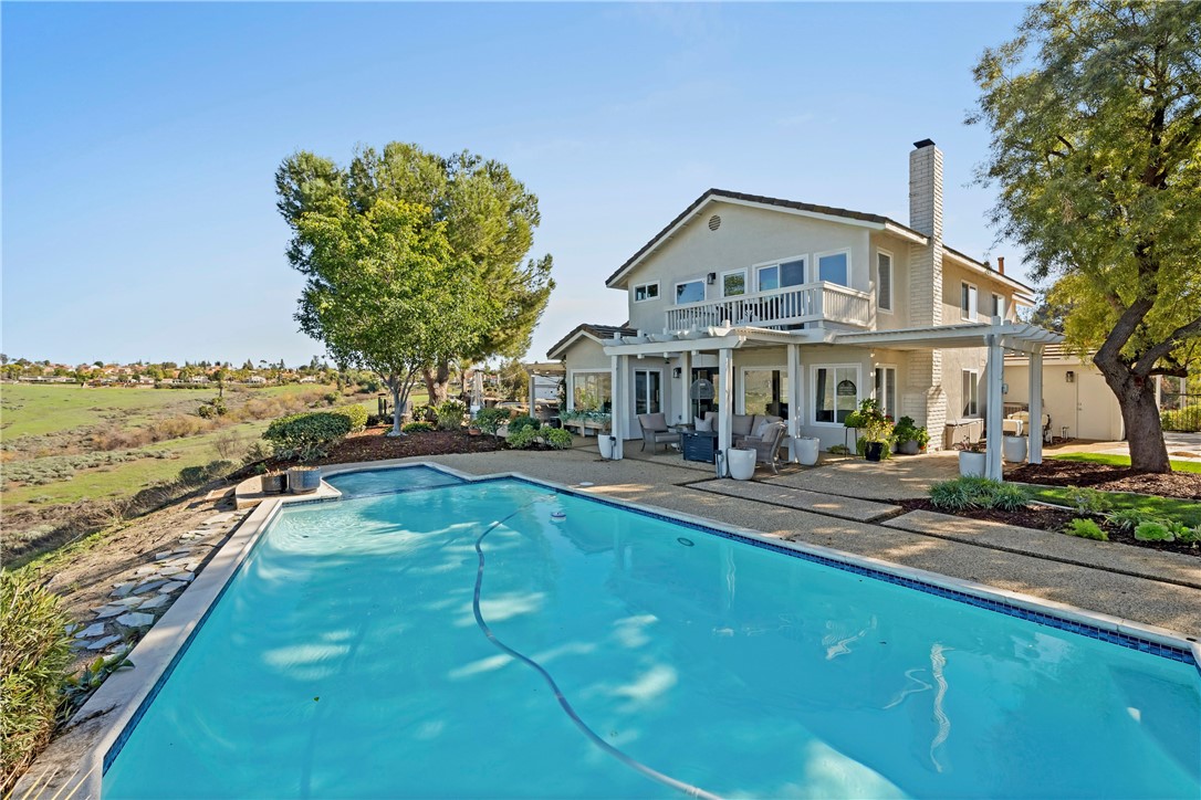 6607 New Ridge Drive Riverside, CA 92506 - Photo 24 of 46 a view of a house with swimming pool and sitting area