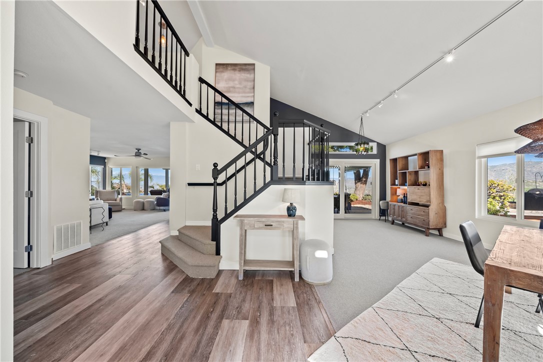 6607 New Ridge Drive Riverside, CA 92506 - Photo 3 of 46 a living room with furniture and stairs with wooden floor