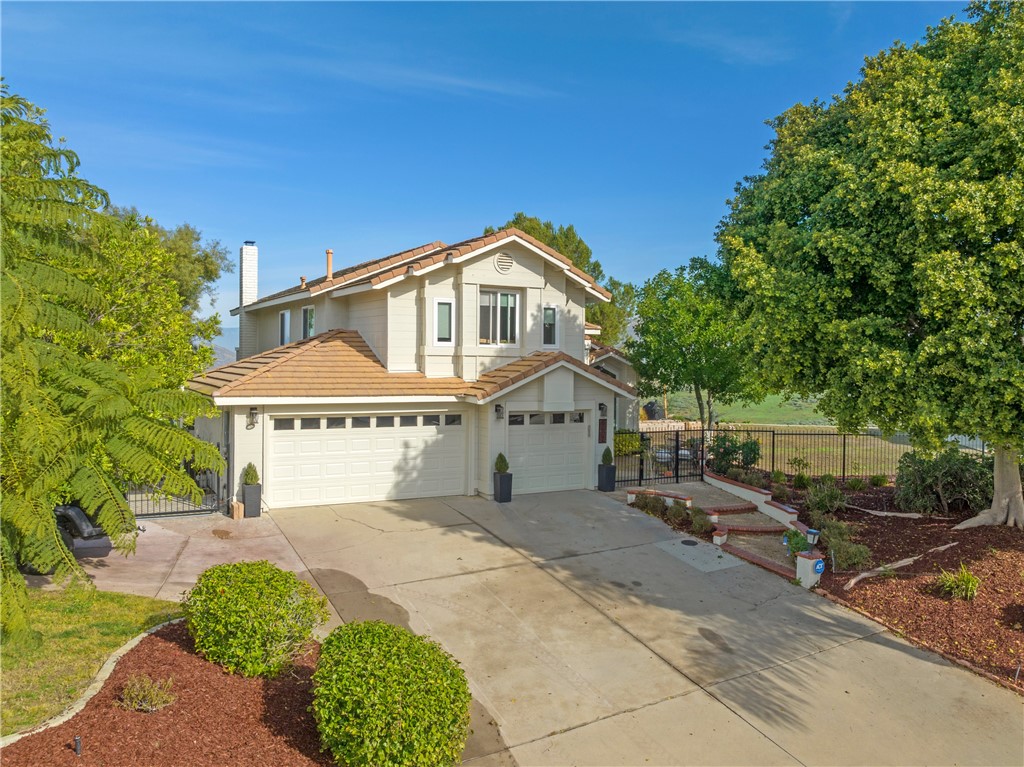 6607 New Ridge Drive Riverside, CA 92506 - Photo 35 of 46 a front view of a house with a garden