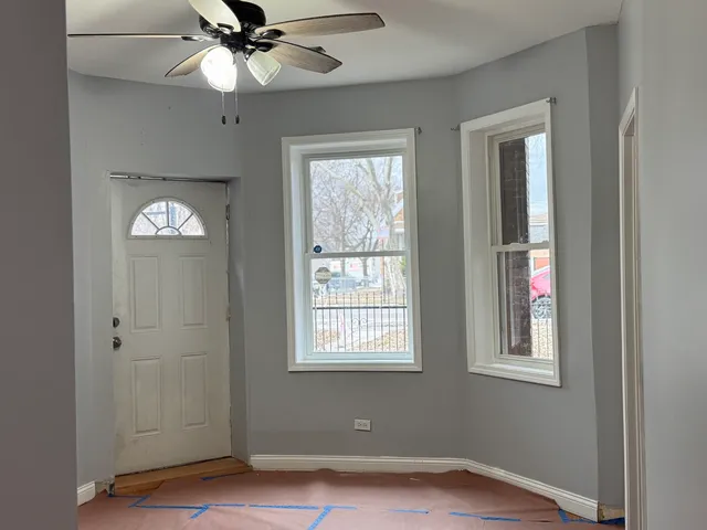 a view of an entryway with a chandelier