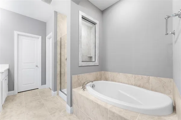 a white bath tub sitting in a bathroom