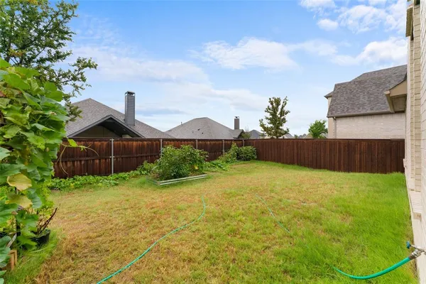 a backyard of a house with lots of green space