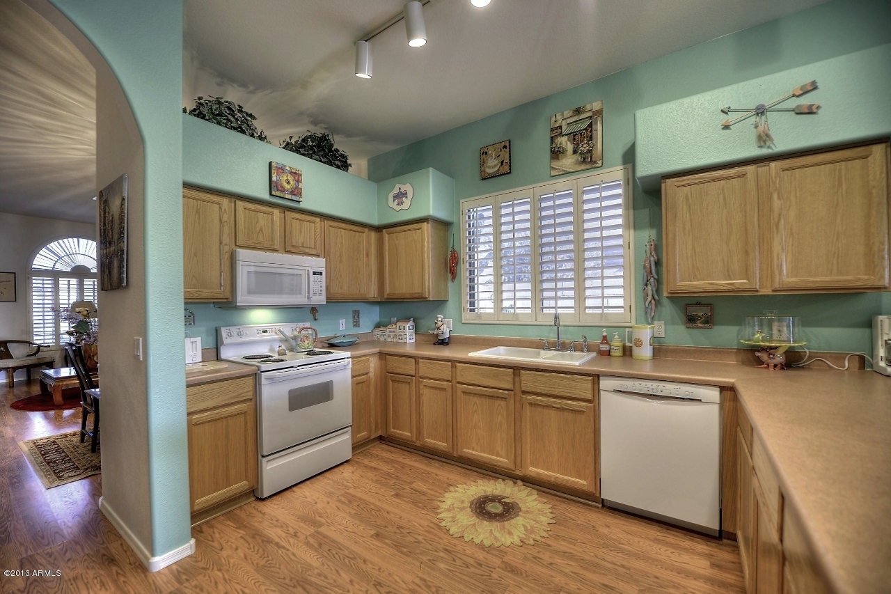 4243 East Tether Trail Phoenix, AZ 85050 - Photo 14 of 28 a kitchen with a sink cabinets and window