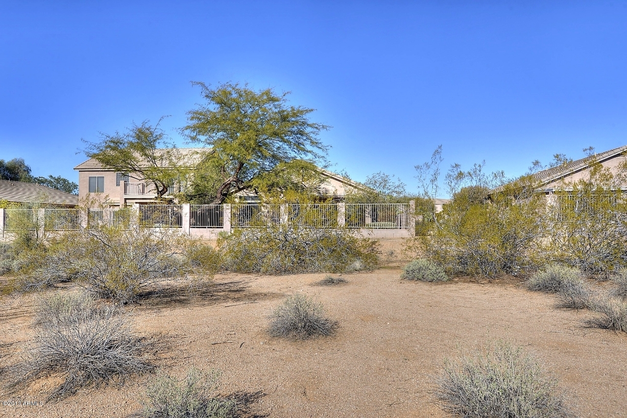 4243 East Tether Trail Phoenix, AZ 85050 - Photo 27 of 28 a front view of a house with a yard