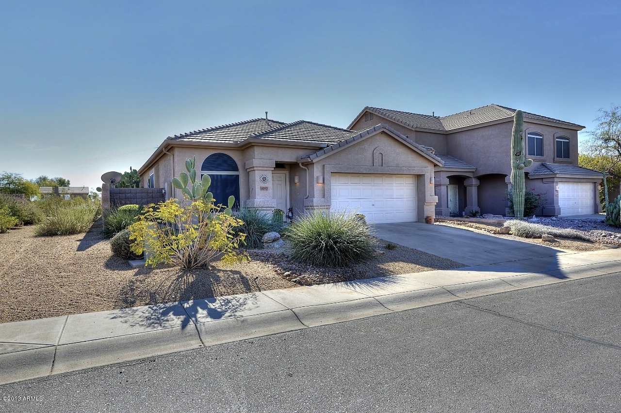 4243 East Tether Trail Phoenix, AZ 85050 - Photo 4 of 28 a front view of a house with a yard