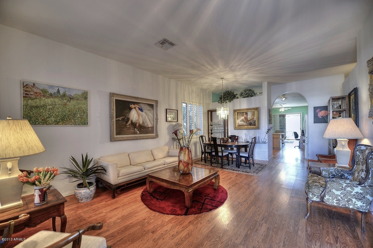 4243 East Tether Trail Phoenix, AZ 85050 - Photo 5 of 28 a living room with furniture and wooden floor