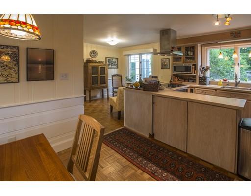 9 Hayward Road Northampton, MA 01062 - Photo 19 of 32 a living room with stainless steel appliances kitchen island granite countertop a table and chairs in it