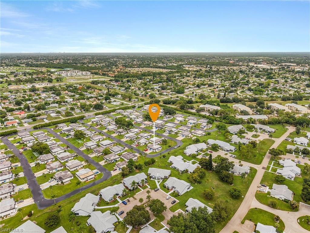 34 Hamlin Court Lehigh Acres, FL 33936 - Photo 28 of 29 an aerial view of residential houses with outdoor space