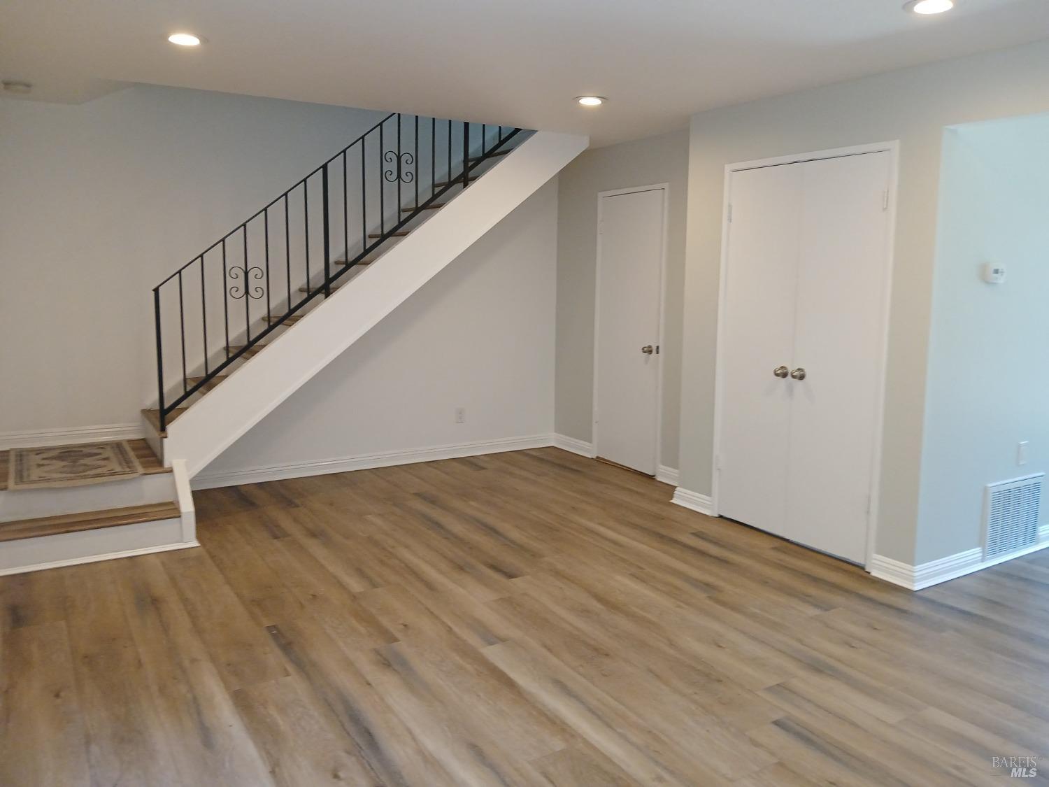 381 Wall Place Santa Rosa, CA 95401 - Photo 8 of 18 a view of entryway and hall with wooden floor