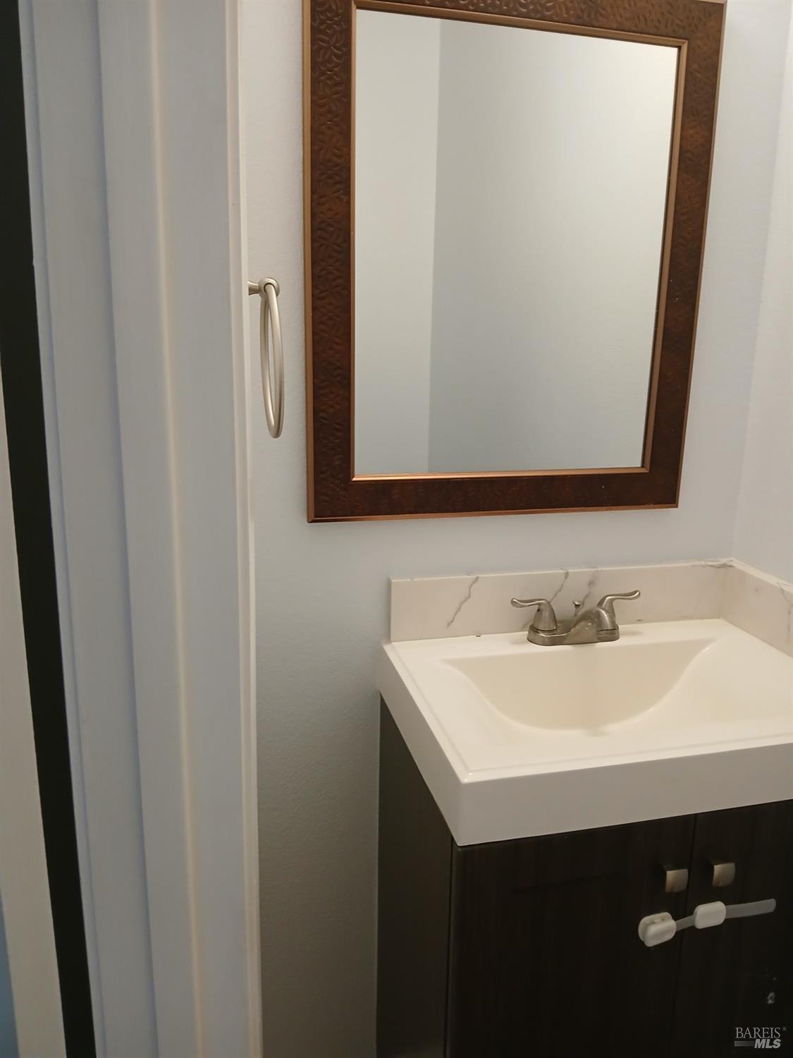 381 Wall Place Santa Rosa, CA 95401 - Photo 9 of 18 a bathroom with a sink and a mirror