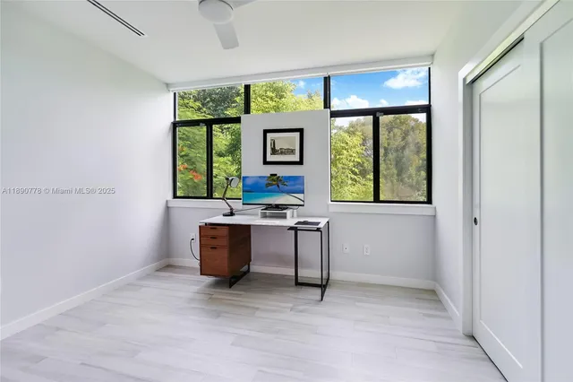 a workspace with furniture and a window