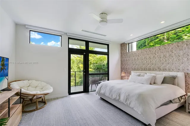 a bedroom with a bed and a chair