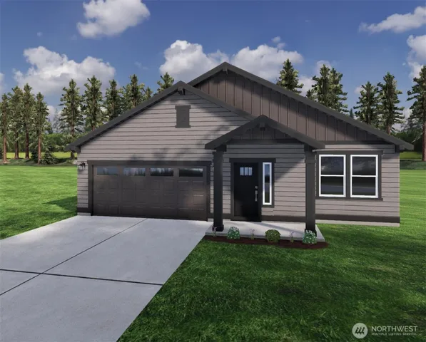 a front view of a house with a garden and yard