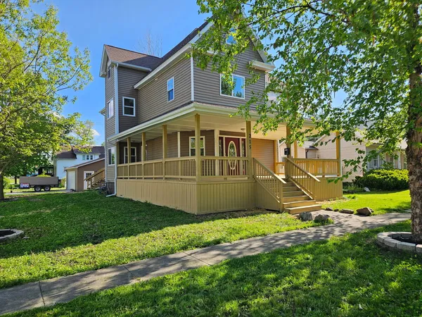 a front view of a house with a yard