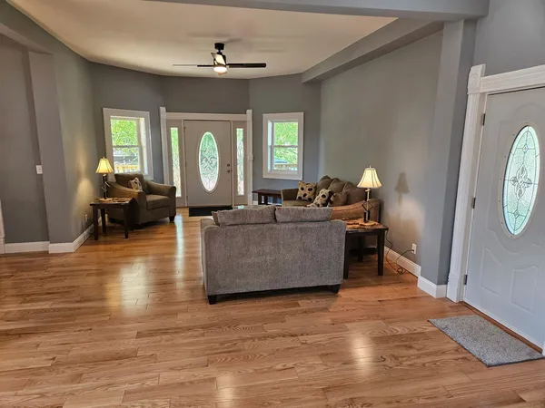 a living room with furniture and a large window