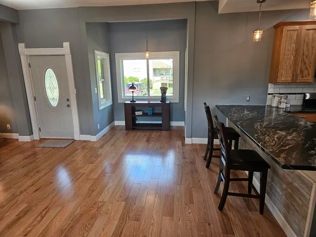 a workspace with furniture and wooden floor