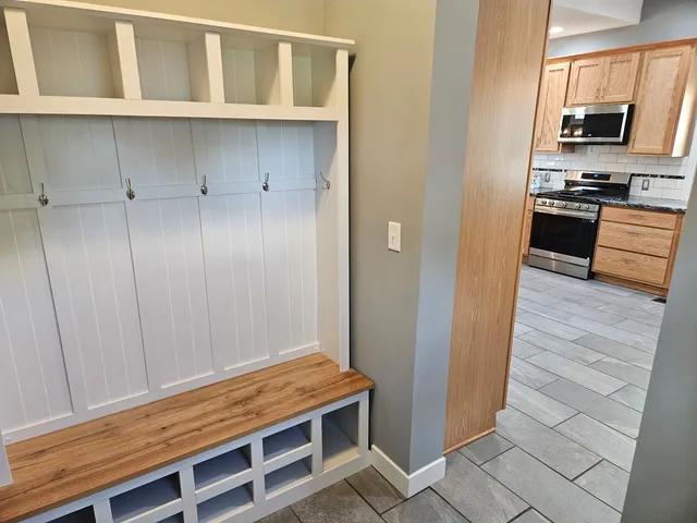 a view of kitchen with cabinets and wooden floor