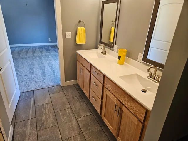 a bathroom with a sink a mirror and a toilet