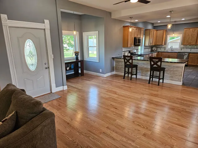 a living room with furniture and a large window