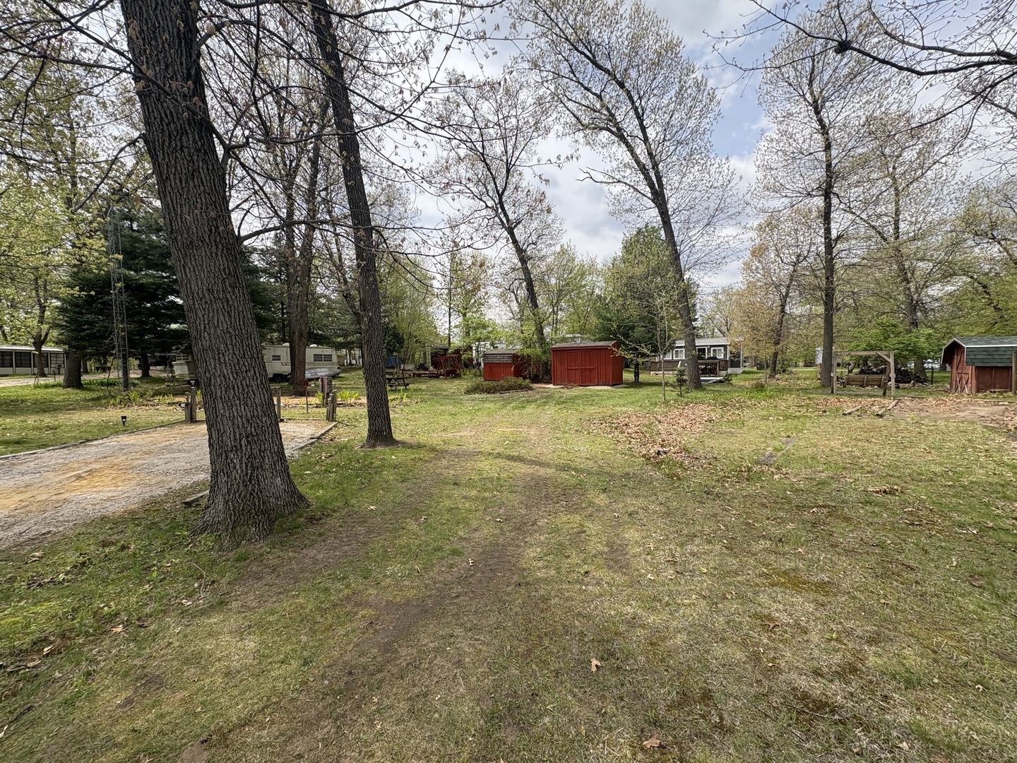 8-50&51 Woodhaven Sublette, IL 61367 - Photo 1 of 5 a view of a yard with a tree