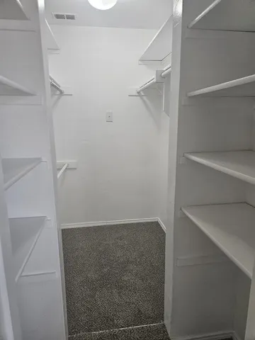 a view of a room with wooden floor and staircase